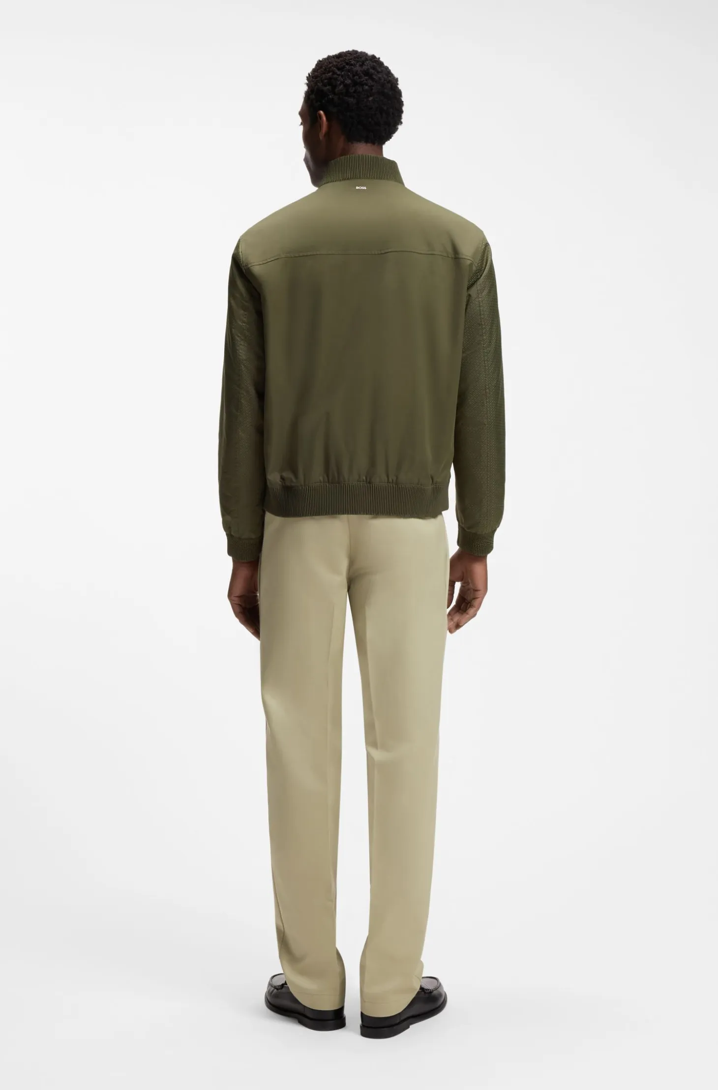 Water-repellent jacket with monogram-pattern sleeves