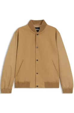 Water-repellent jacket with monogram-pattern sleeves