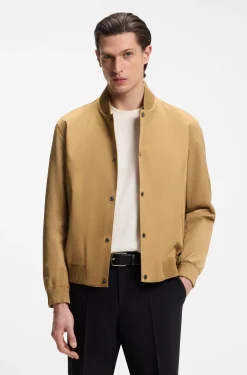 Water-repellent jacket with monogram-pattern sleeves