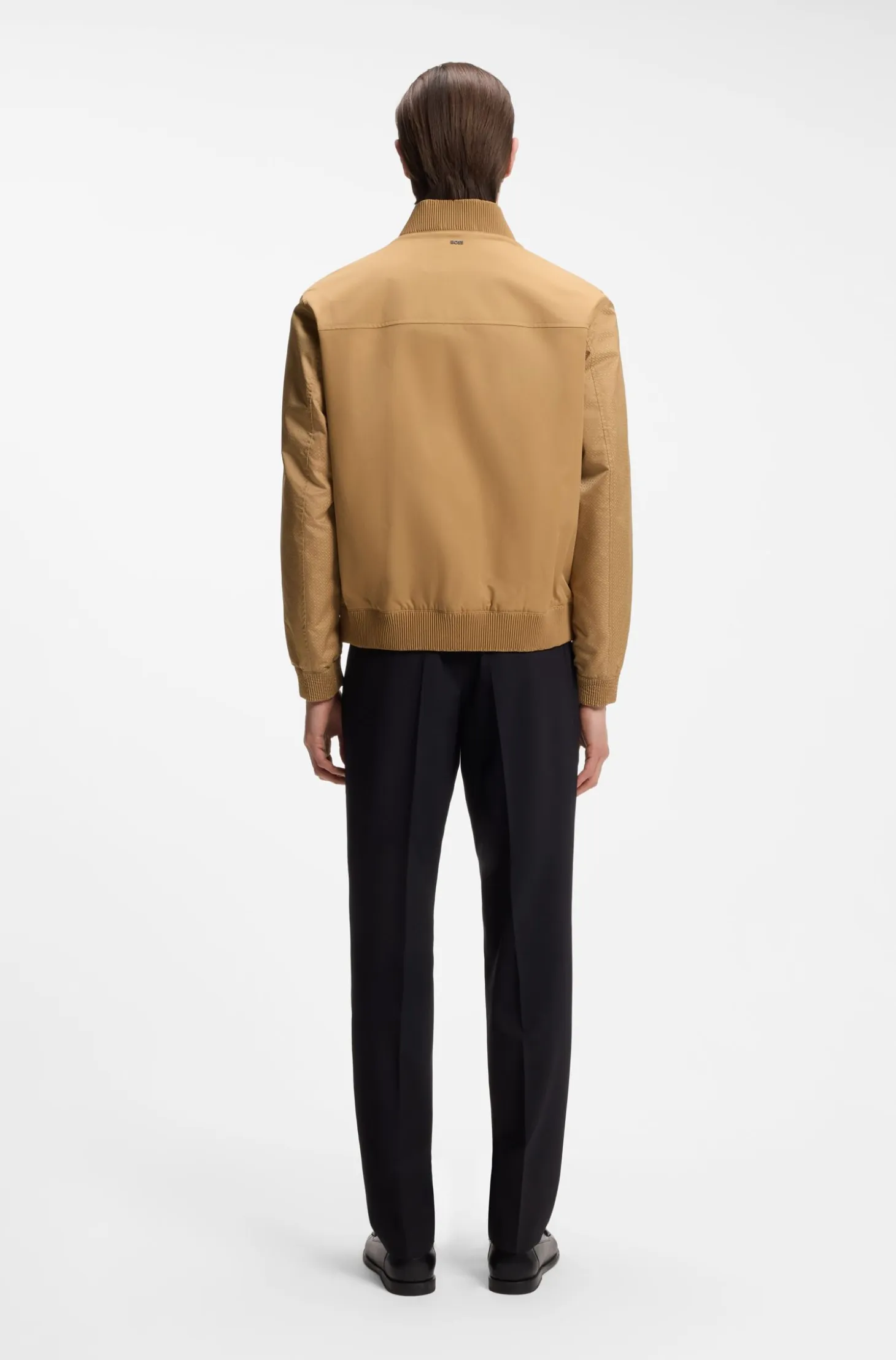 Water-repellent jacket with monogram-pattern sleeves