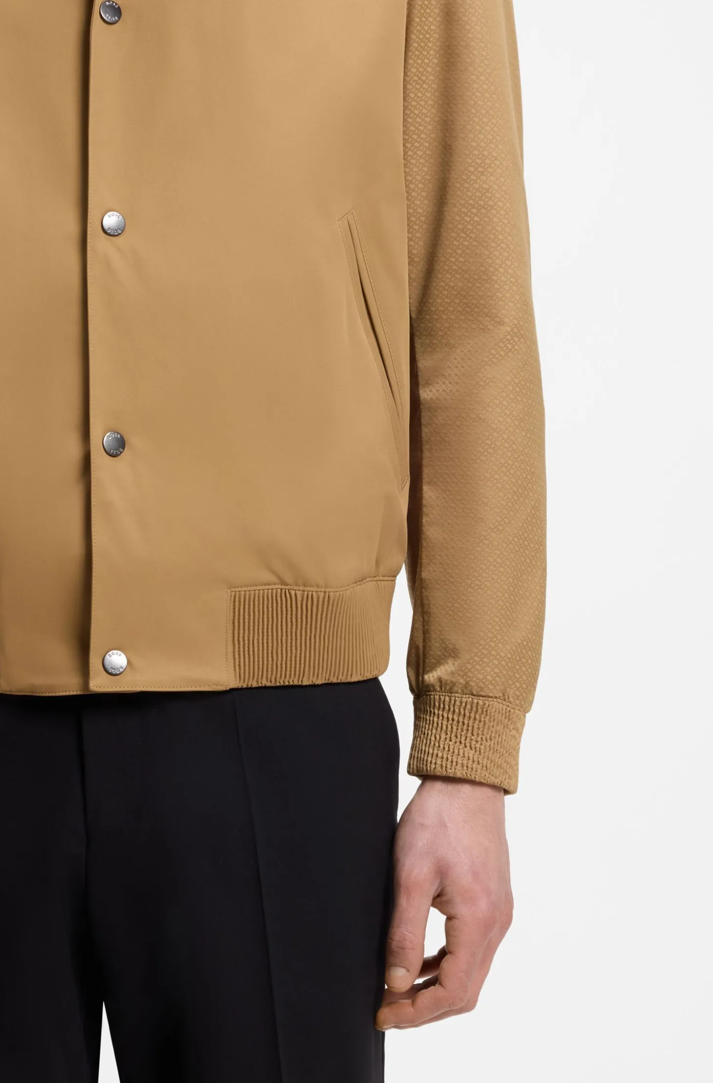 Water-repellent jacket with monogram-pattern sleeves