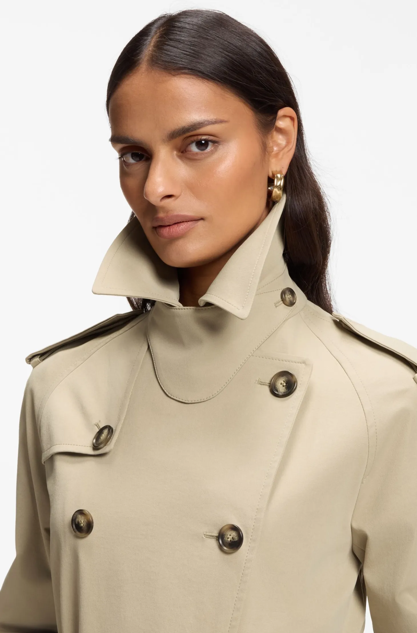 Water-repellent trench coat with buckled belt