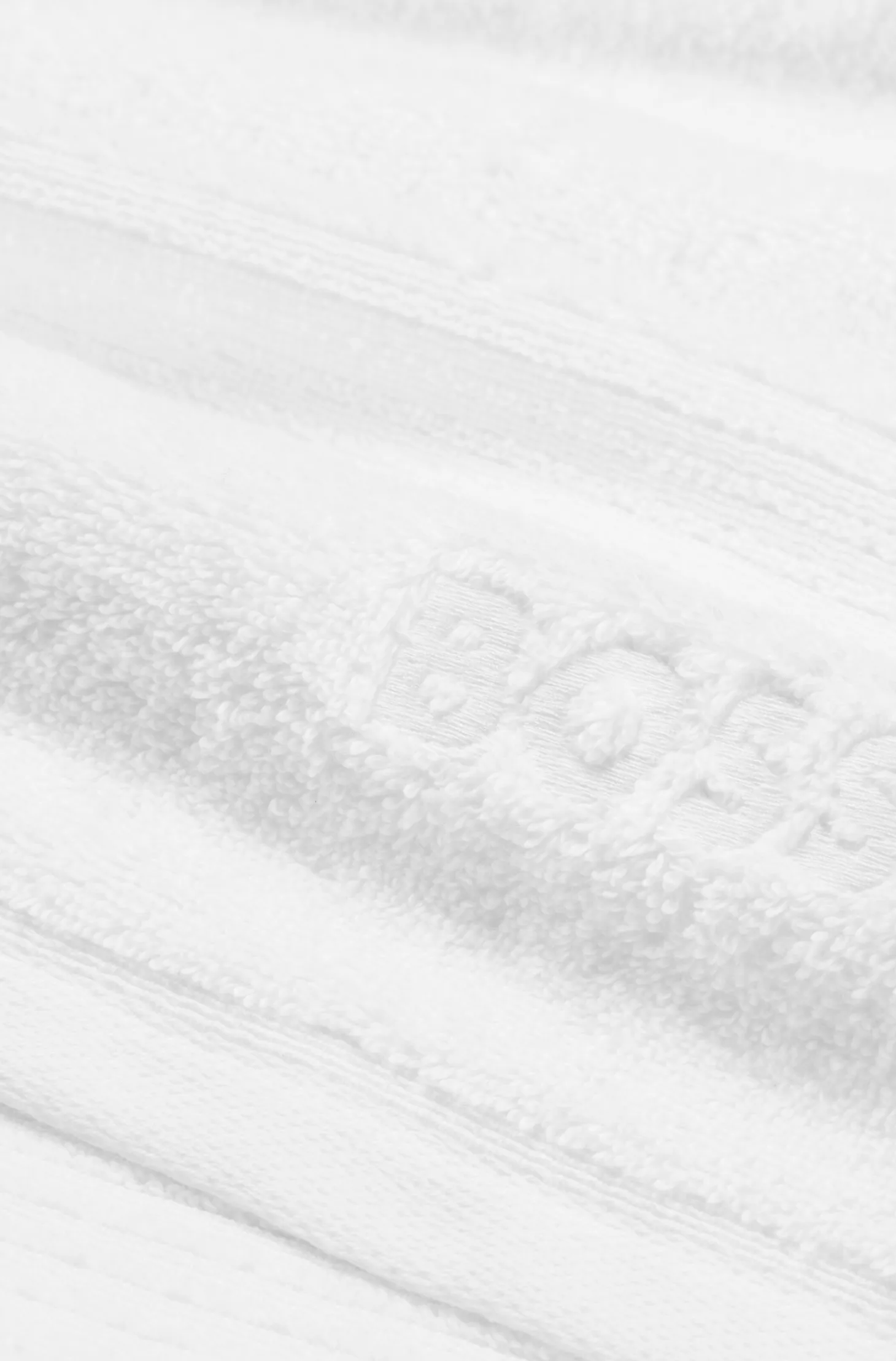 White cotton hand towel with embroidered logo